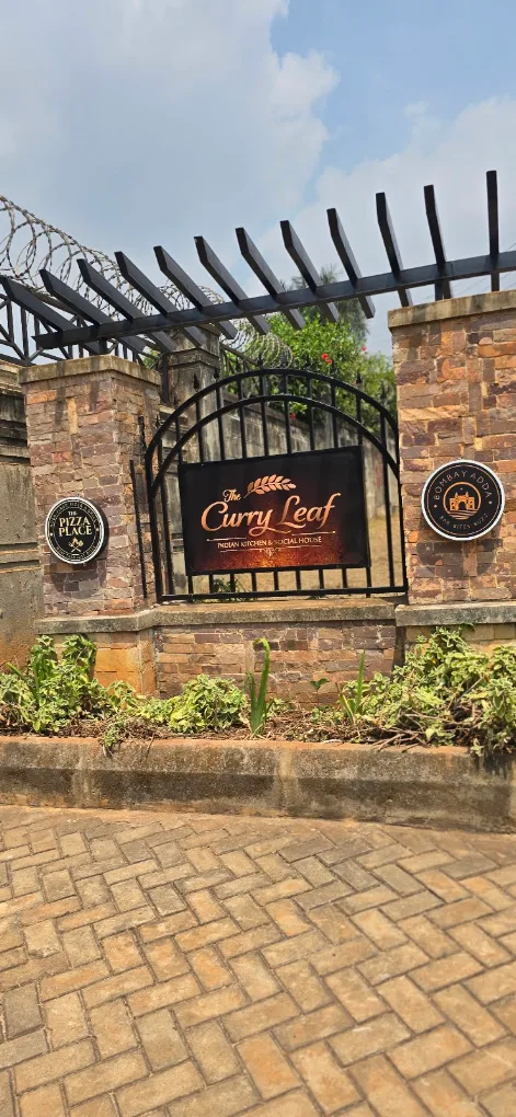 The Curry Leaf entrance sign in Lubowa
